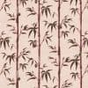Vertical maroon bamboo stalks with dark green leaves and small hanging oval pods — arranged in repeating printed columns — on a pale pink textured wallpaper or fabric background.