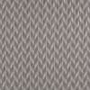 Chevron-patterned wallpaper with thin vertical striations forming repeating zigzag diamonds; the pattern covers a flat surface in muted taupe-gray tones, shown close-up with even, neutral lighting.