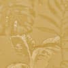 Oversized tropical leaves form a repeating botanical pattern in warm mustard-yellow tones, rendered with subtle highlights and a visible woven fabric texture across the background.