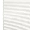 White honeycomb (cellular) pleated blind fully lowered, tightly folded horizontal cells; closed and diffusing light, shown against a bright white background in even studio lighting.