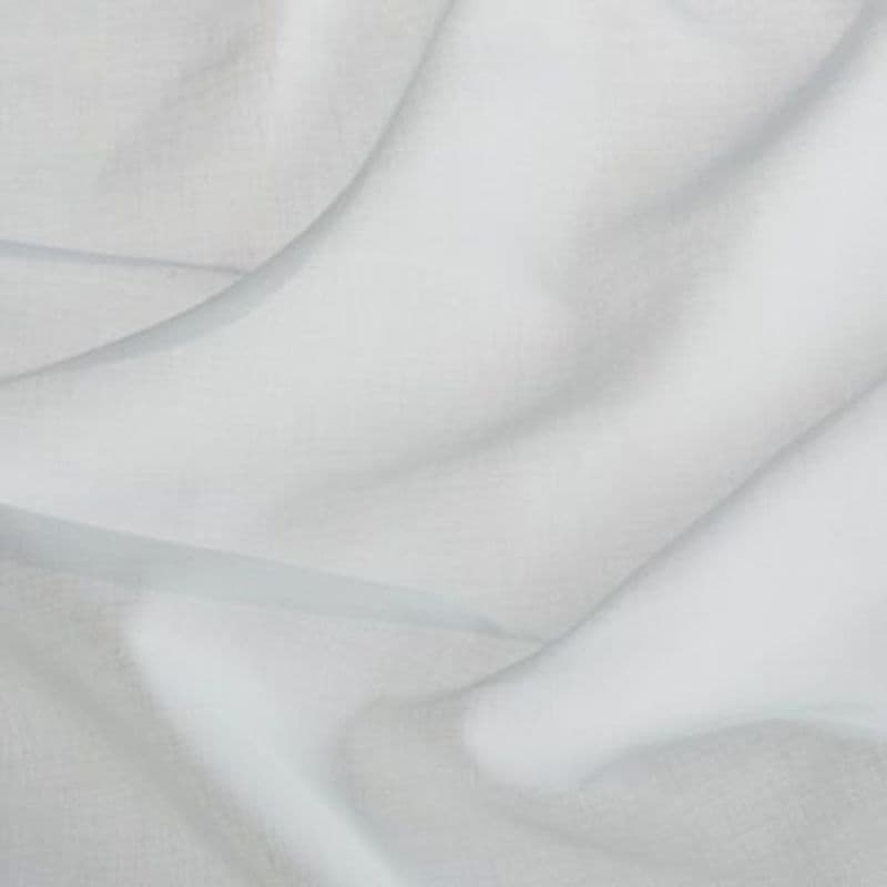 Sheer white curtain fabric, layered and draped in soft folds, gently filtering diffuse daylight; close-up interior window treatment showing subtle linen texture and delicate translucence.