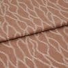 Folded terracotta-brown fabric with raised white embroidered undulating chain pattern, folded over itself with a horizontal overlap, close-up studio view emphasizing woven texture and soft, even lighting.