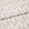 Beige-and-ivory geometric woven fabric with repeating angular, three-dimensional pattern; folded over itself, showing texture and slight sheen; studio-lit close-up on a neutral background, suited for upholstery or curtains.