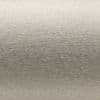 Brushed metal panel with fine horizontal grain; surface displays subtle sheen and faint gradient, reflecting soft diffuse light; close-up, neutral plain background with even studio lighting.