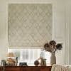 Beige fabric Roman blind with stitched diamond pattern, lowered to cover the window and softly filtering daylight. Beside a wooden console with lamp, books and a vase of dried flowers.
HOMES FOR OUR TIME
EVERYTHING ABIGAIL AHERN