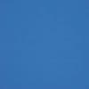 Solid blue fabric-like panel filling the frame, evenly lit and subtly textured; appears as a flat blue wall or clear sky with no distinguishing features or objects.