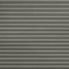 Gray horizontal pleated fabric blinds, fully lowered and tightly closed, blocking light; occupy the entire frame against a neutral interior wall, creating uniform textured shading and soft, even ambient light.
