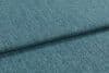 Teal textured upholstery fabric, folded into overlapping layers with visible weave and nap; lying flat as a close-up sample under soft diffuse lighting, showing subtle color variation.