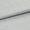 Light gray woven fabric, folded with a visible hem edge across the frame; tightly textured weave and subtle nap; close-up studio-lit shot on a neutral surface, soft even lighting.