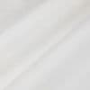 White fabric with a diagonal fold forming a soft shadowed ridge; light subtly diffused across its smooth woven texture in a bright, minimal interior.