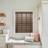 Brown wooden horizontal blinds with dark vertical tapes, fitted in a central window; closed, filtering daylight; cozy kitchen bench nook with cushions, pale walls, shelving and a bread box.
BREAD
THE PIG
TASTING ROME