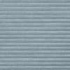 Horizontal pleated cellular blind, light-blue textured fabric with subtle cross-hatch pattern; fully closed, forming even horizontal folds; interior setting with soft, diffused light and no visible outside view.