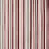Striped fabric curtain, vertically patterned with alternating red, burgundy, pink, beige, gray and white bands; hanging closed, smoothing toward floor; fills an interior wall with even, neutral lighting.