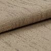 Rolled beige woven fabric with subtle darker linear pattern, folded at the edge — resting on a matching fabric surface in a close-up, softly lit studio shot emphasizing texture.