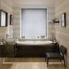 Horizontal venetian blinds lowered over the window, closed thin slats diffusing soft daylight; set above a dark-wood bathtub in a lit bathroom with striped walls, sink, shelf and chair.