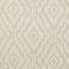 Beige woven fabric or wallpaper with stepped ikat diamond pattern, repeating across the surface; muted tones and subtle texture create a softly lit, neutral background suitable for interiors.