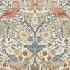 Symmetrical arrangement of stylized birds and large blooms woven into dense flowering vines on a repeating tapestry-like background; muted pink, blue, olive and beige palette evokes vintage wallpaper.