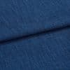 Blue textured upholstery fabric (tight weave) folded across the frame, showing a horizontal crease; close-up studio-lit view emphasizing coarse threads and uniform deep-blue color.