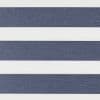 Horizontal striped fabric blind with wide navy-blue textured bands alternating with white translucent bands — positioned closed to block and filter light — fills a neutral, evenly lit interior.