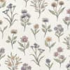 Delicate wildflower sprigs are scattered upright, each hand-drawn and softly colored with greens, purples, yellows and pinks, printed on a cream, textured fabric background as a repeating pattern.