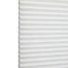 White honeycomb (cellular) blind with horizontal pleats, closed and softly diffusing daylight; minimal, bright interior with no visible furniture or view.