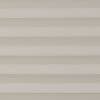 Horizontal beige pleated shades, fully closed with evenly spaced fabric folds, filtering diffuse light; interior setting with neutral tones and no visible view, producing a uniform, muted appearance.