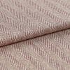 Woven upholstery fabric with beige-and-burgundy diagonal herringbone stripes and ribbed texture; folded and overlapped to reveal the pattern repeat; close-up, evenly lit studio setting.