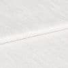 White ribbed textured fabric, folded in overlapping layers showing subtle horizontal sheen; lying stacked on itself, photographed in close-up under soft, even studio lighting with a neutral background.