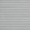 Gray pleated cellular blinds, fully lowered with horizontal fabric cells and subtle texture; closed and filtering diffuse daylight; covering an interior window in a softly lit room, no view visible.