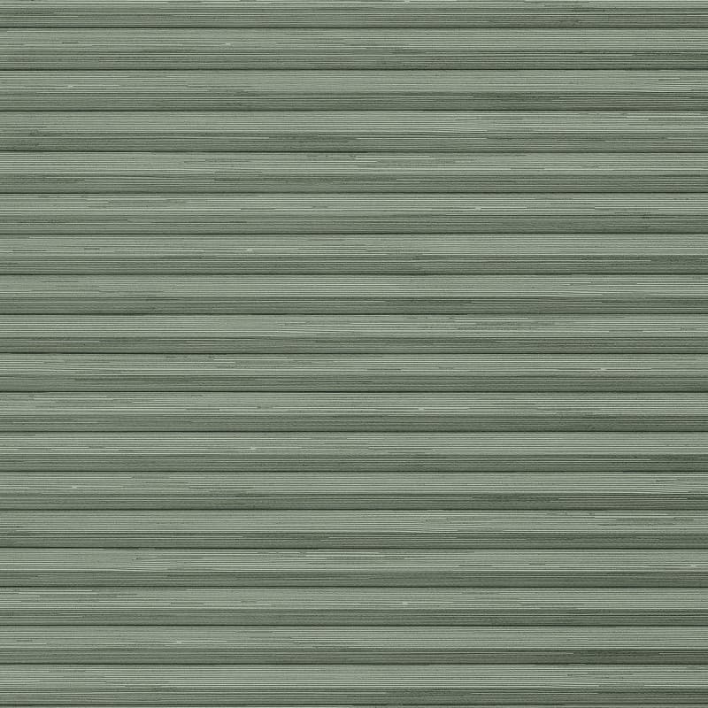 Pale-green horizontal metal rolling shutter with narrow ribbed slats dominates frame; fully closed, slightly weathered; exterior storefront or garage façade under even daylight.