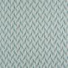 Textured wallpaper covering a wall, patterned with repeating teal vertical chevron-like dashes and subtle woven lines; decorating an evenly lit interior surface.