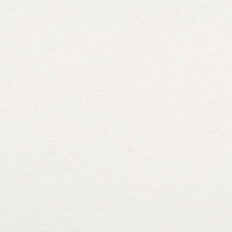 Off-white textured paper fills the frame, displaying faint fibers and tiny speckles; evenly lit and blank, serving as a neutral, softly toned background with no visible objects or window dressings.