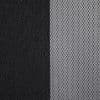 Two window dressings — a solid black blackout curtain (left) and a white woven sheer panel (right) — hang closed, the sheer filtering light; close-up interior view with neutral lighting.