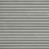 Grey pleated cellular blinds across the frame, closed with uniform horizontal folds and textured fabric; blocking view and softly diffusing light in a neutral, minimally lit interior.