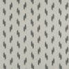 Woven beige fabric featuring staggered dark-gray abstract brushstroke motifs; motifs repeat in vertical columns, forming a regular geometric pattern across a flat, evenly lit close-up surface.