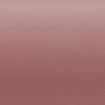 Dusty rose fabric-like panel fills the frame, showing a subtle horizontal gradient and fine texture, evenly lit against a neutral, featureless background with soft, diffuse light.
