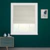Beige fabric Roman blind, lowered with a small bottom fold across a white-framed window; filtering soft daylight; set on a teal-painted wall above a mid-century dresser and framed abstract art.