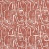 Abstract patterned wallpaper of white, irregular outline shapes repeating across a distressed terracotta background, covering a flat interior wall; modern decorative motif with muted, even lighting.