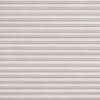 Horizontal pleated cellular blinds, full-width and fully lowered, pale blush textured fabric; closed and filtering soft diffuse light, concealing the window and creating a uniformly lit, neutral interior surface.